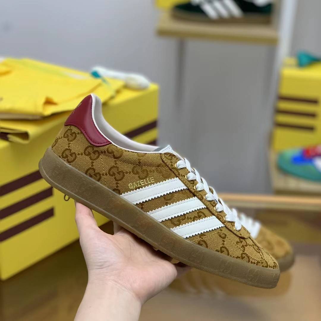 GU*I× Adidas sneakers